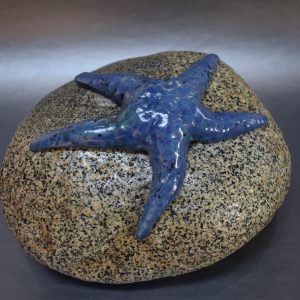 Decorative door stop, sea star on a rock by Ed Oldfield