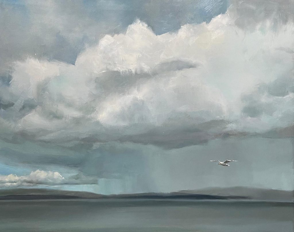 Landscape with rain clouds and seagull in flight over water