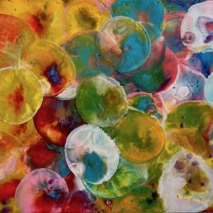 Colourful encaustic rectangular painting of abstracted jellyfish in yellow, orange, blue and green
