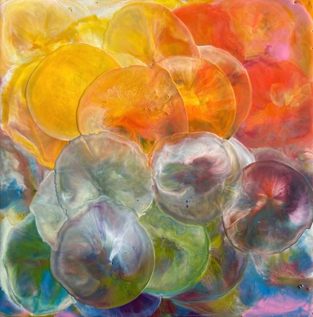 Colourful encaustic square painting of abstracted jellyfish in yellow, orange, blue and green,