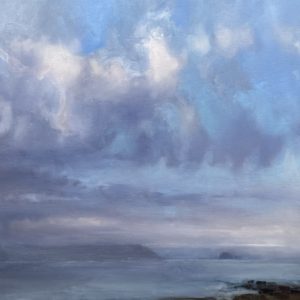 Impressionist and athmospheric seascape with whispy clouds dispersing over distant islands clad in mist